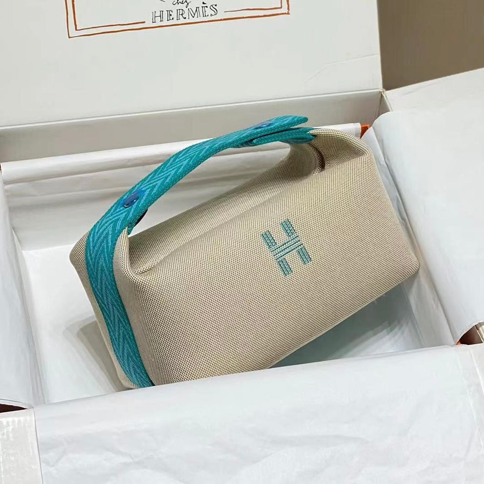 Hermes Bride à brac cloth vanity case in beige Canvas with Teal Green Handle 22 cm