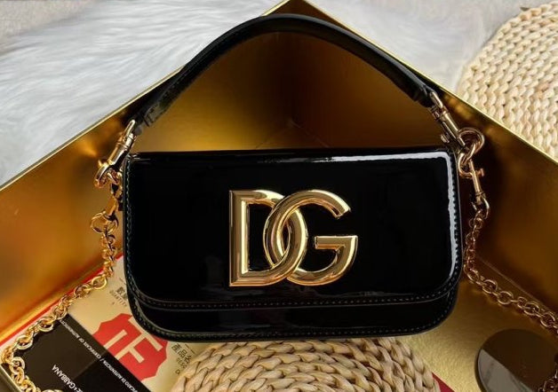 Dolce & Gabbana Shoulder bag in Black patent leather with a Gold Chain DG logo