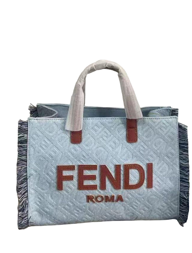 Fendi Sunshine Shopper Tote Bag in Light Blue Quilted Denim with Brown Leather Details and Fringe Trim – 32 cm