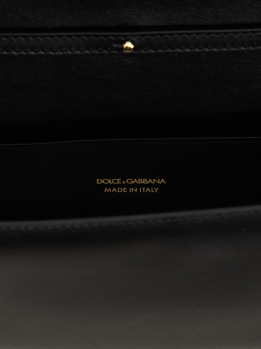 Dolce & Gabbana Shoulder bag in Black made of calfskin leather with a Gold Chain DG logo