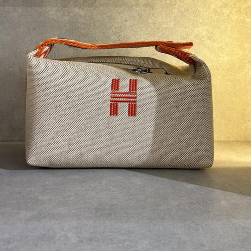 Hermes Bride à brac cloth vanity case in beige Canvas with orange/white Handle 22 cm