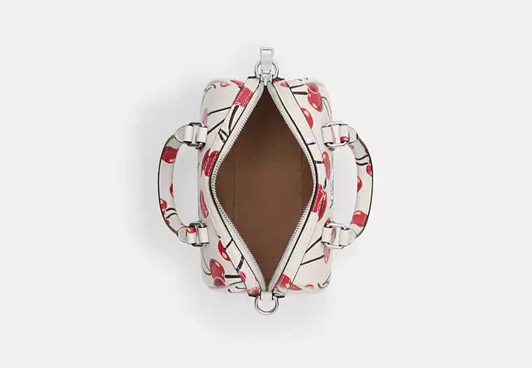 Coach Mini Rowan Crossbody 20 cm white with a cherry print.