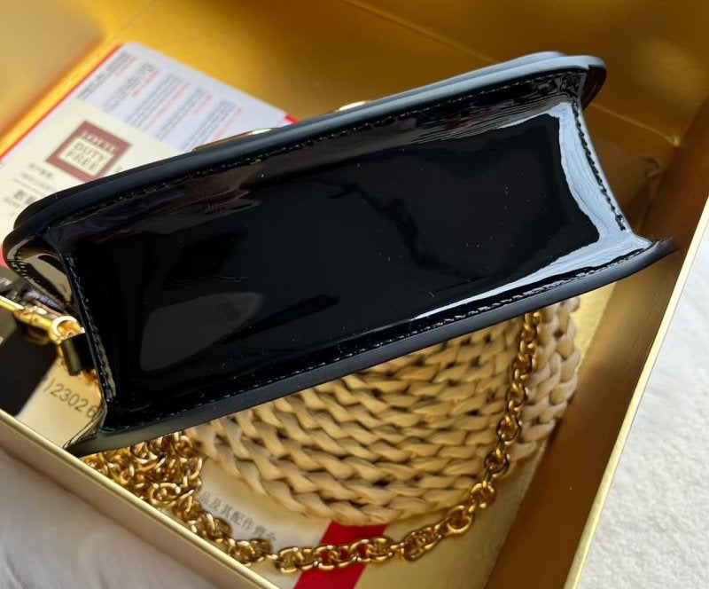 Dolce & Gabbana Shoulder bag in Black patent leather with a Gold Chain DG logo