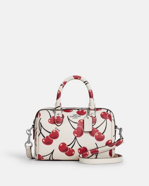 Coach Mini Rowan Crossbody 20 cm white with a cherry print.
